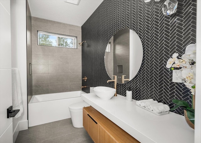 27603 N Bruce Rd, Chattaroy, WA 99003 - bathroom with toilet, vanity, bathtub / shower combination, and tile walls