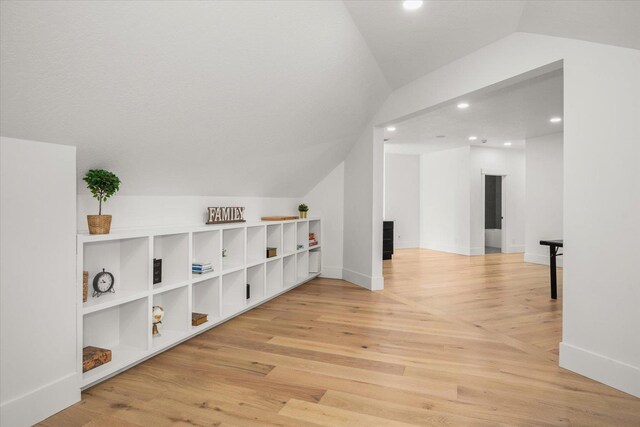 27603 N Bruce Rd, Chattaroy, WA 99003 - interior space featuring recessed lighting, vaulted ceiling, baseboards, and wood finished floors