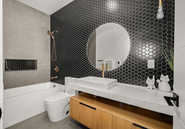 27603 N Bruce Rd, Chattaroy, WA 99003 - bathroom with tile walls, bathing tub / shower combination, vanity, and toilet