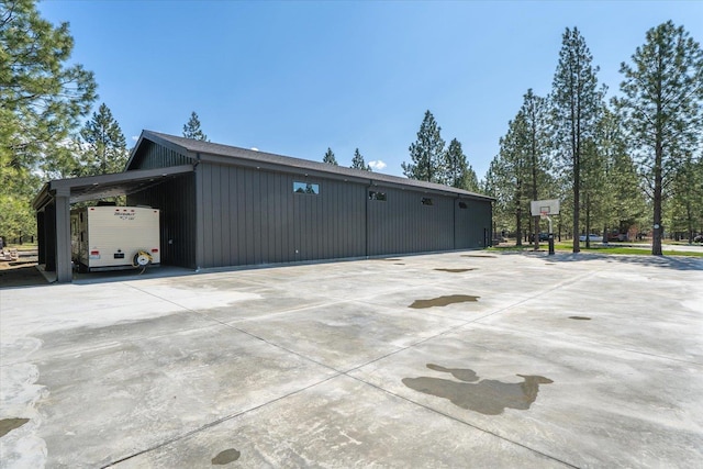 27603 N Bruce Rd, Chattaroy, WA 99003 - view of side of property featuring an attached carport and concrete driveway