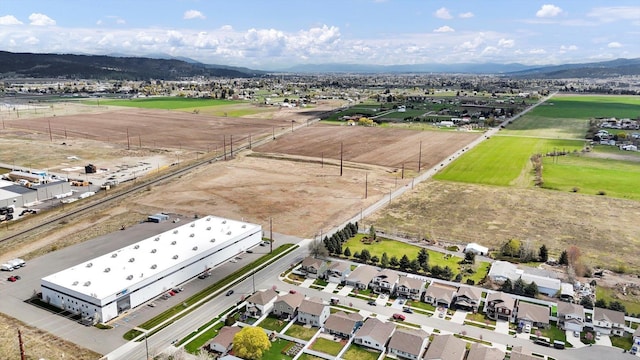 birds eye view of property with a mountain view