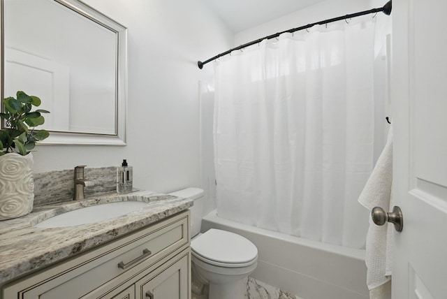 full bathroom with shower / tub combo with curtain, marble finish floor, vanity, and toilet