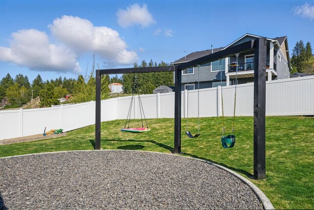 view of jungle gym featuring a fenced backyard and a lawn