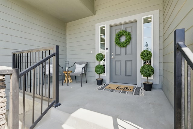view of exterior entry with covered porch