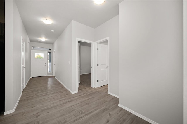 entrance foyer featuring wood finished floors and baseboards