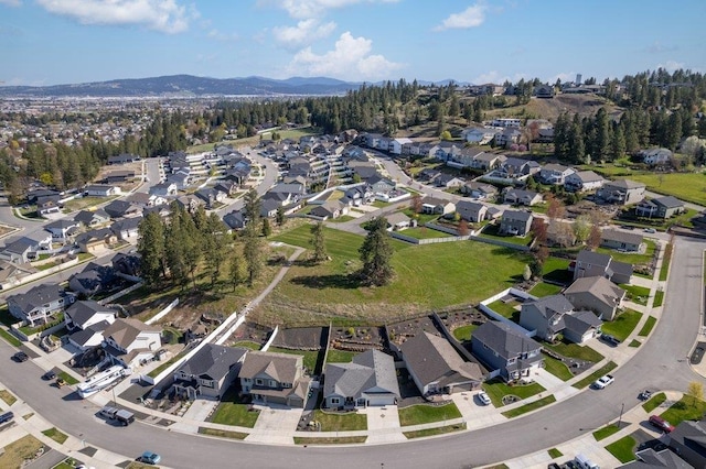 drone / aerial view featuring a mountain view and a residential view