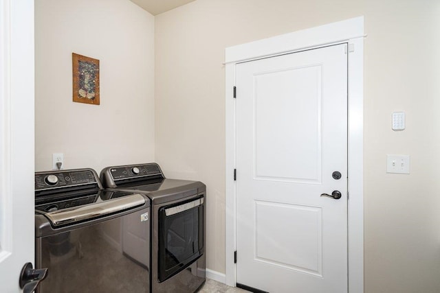clothes washing area with laundry area and washing machine and dryer