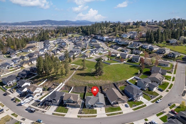 birds eye view of property featuring a mountain view and a residential view