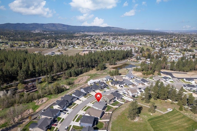 birds eye view of property featuring a mountain view and a residential view