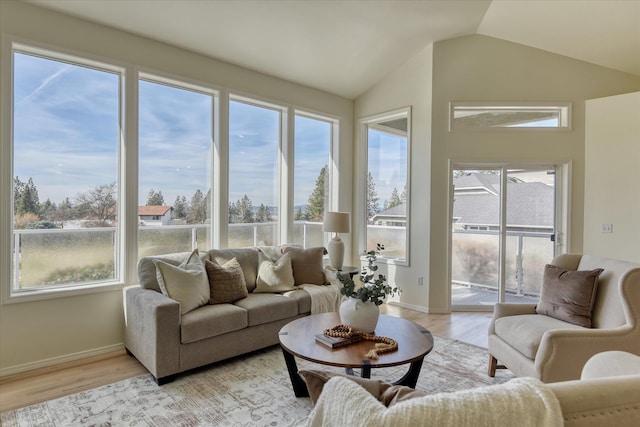 1814 S Viewcrest Ln Unit 1814, Spokane Valley, WA 99212 - living room with light wood-style floors, vaulted ceiling, and baseboards