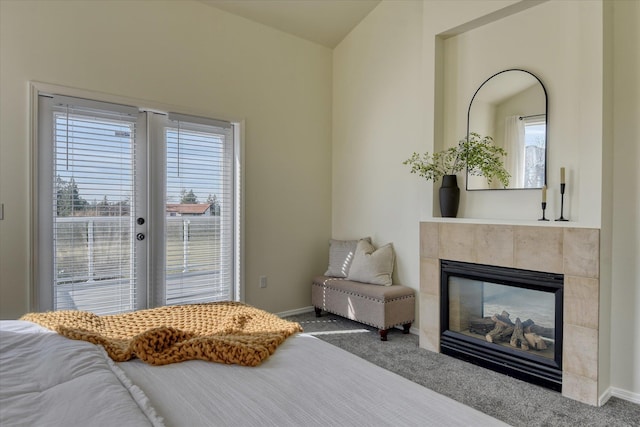 1814 S Viewcrest Ln Unit 1814, Spokane Valley, WA 99212 - carpeted bedroom with multiple windows, a tiled fireplace, access to outside, and baseboards