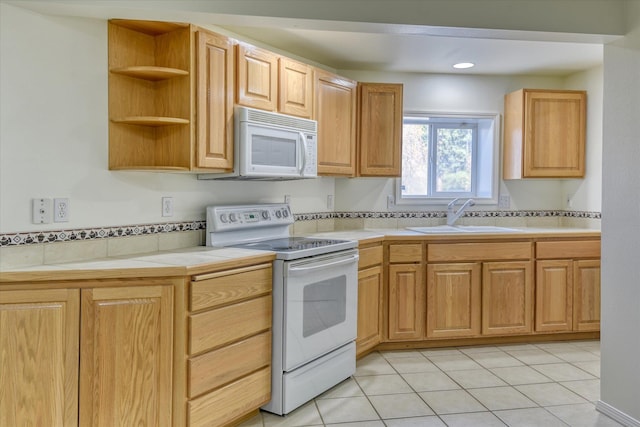 1814 S Viewcrest Ln Unit 1814, Spokane Valley, WA 99212 - kitchen featuring white appliances, a sink, light tile patterned floors, tile countertops, and open shelves