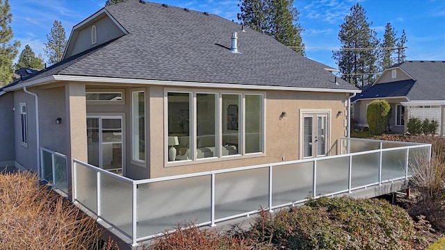 1814 S Viewcrest Ln Unit 1814, Spokane Valley, WA 99212 - rear view of house with stucco siding and a shingled roof