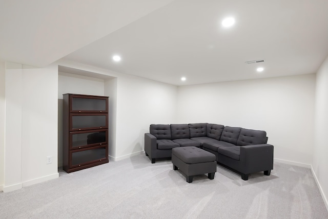 living area featuring recessed lighting, visible vents, light colored carpet, and baseboards