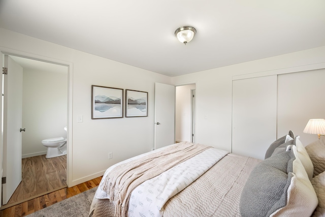 11904 E 22nd Ave, Spokane Valley, WA 99206 - bedroom with light wood finished floors, a closet, and baseboards