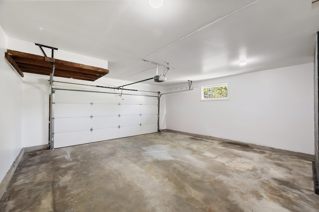 11904 E 22nd Ave, Spokane Valley, WA 99206 - garage featuring baseboards and a garage door opener