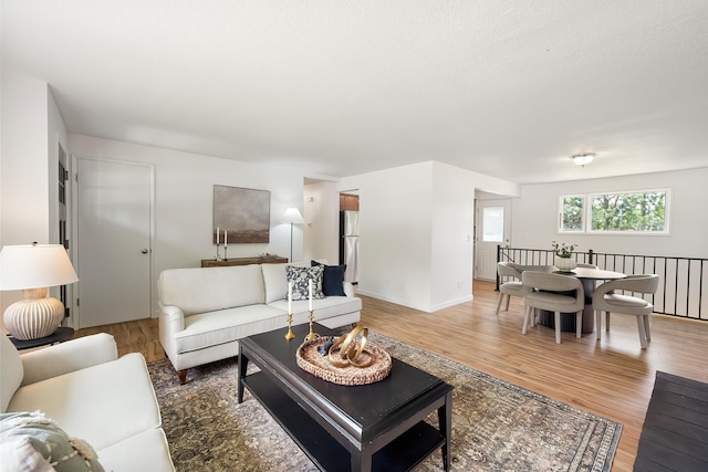 11904 E 22nd Ave, Spokane Valley, WA 99206 - living room with light wood-style floors and baseboards