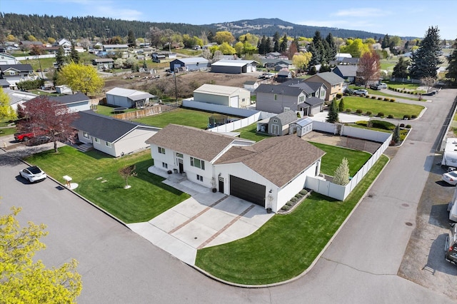 birds eye view of property featuring a mountain view and a residential view