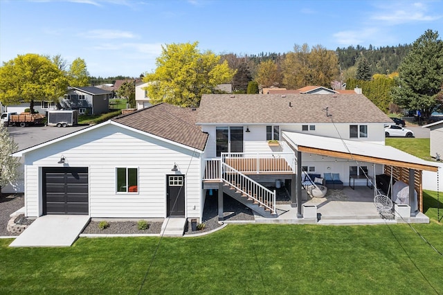 back of property with a yard, a shingled roof, a patio, a wooden deck, and stairs