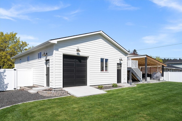 rear view of property featuring fence, stairway, a yard, and a wooden deck