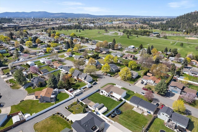 aerial view with a mountain view, a residential view, and view of golf course