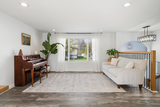 living area with recessed lighting and wood finished floors