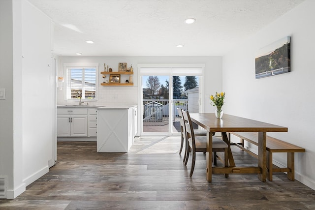 dining area with recessed lighting, baseboards, and dark wood-type flooring