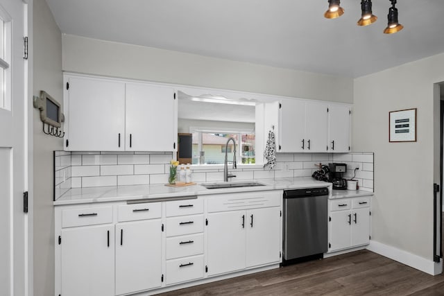 kitchen with dark wood finished floors, backsplash, dishwasher, a sink, and white cabinetry