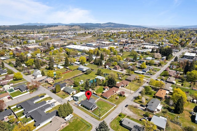 birds eye view of property featuring a mountain view