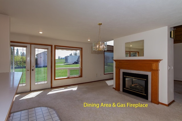 unfurnished living room featuring a tiled fireplace, recessed lighting, and carpet