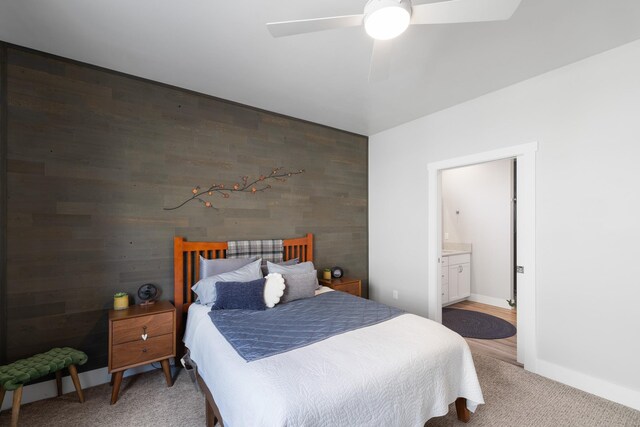 3306 N Ladalia Dr, Coeur D Alene, ID 83814 - bedroom featuring an accent wall, connected bathroom, light colored carpet, ceiling fan, and baseboards
