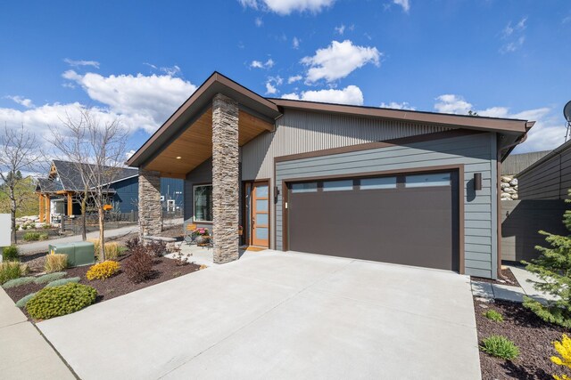 3306 N Ladalia Dr, Coeur D Alene, ID 83814 - contemporary house featuring driveway and an attached garage