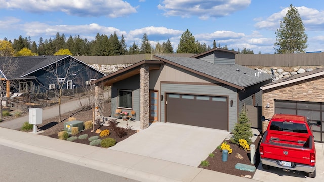 3306 N Ladalia Dr, Coeur D Alene, ID 83814 - view of front of house with concrete driveway, a shingled roof, and a garage