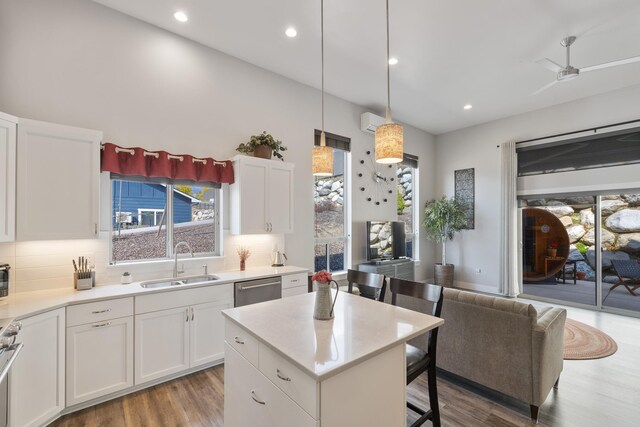 3306 N Ladalia Dr, Coeur D Alene, ID 83814 - kitchen with tasteful backsplash, wood finished floors, stainless steel appliances, and a sink