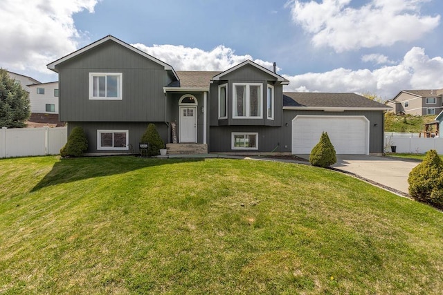 1134 S Moen St, Greenacres, WA 99016 - split foyer home featuring concrete driveway, a garage, and roof with shingles
