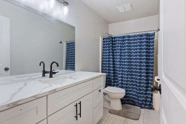 full bathroom featuring toilet, tile patterned flooring, visible vents, and vanity