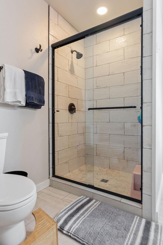 full bathroom with toilet, a shower stall, recessed lighting, and baseboards
