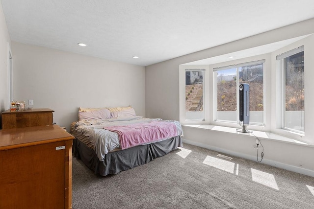 carpeted bedroom with visible vents, recessed lighting, and baseboards