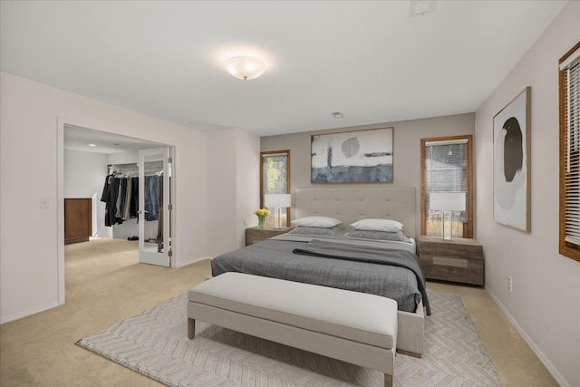 2711 S Pittsburg St, Spokane, WA 99203 - bedroom featuring light colored carpet, baseboards, a walk in closet, and a closet