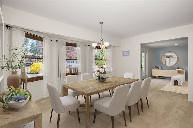 2711 S Pittsburg St, Spokane, WA 99203 - dining room featuring light carpet, a chandelier, and baseboards
