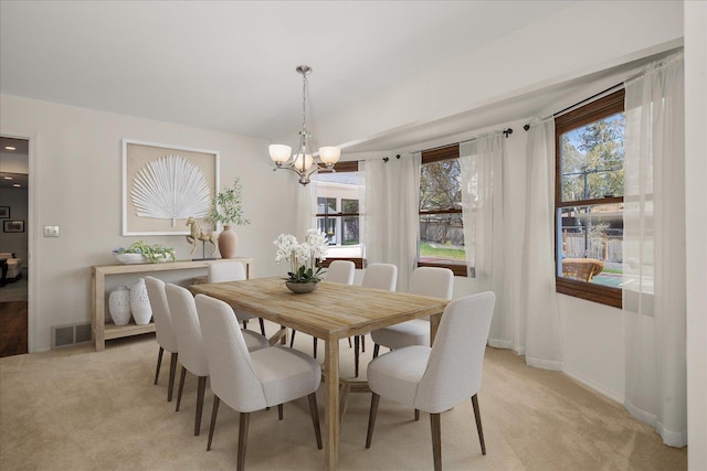 2711 S Pittsburg St, Spokane, WA 99203 - dining space featuring a chandelier, light colored carpet, and plenty of natural light