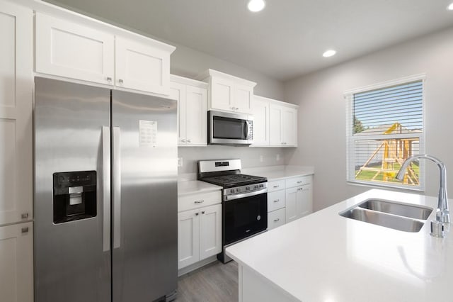 1102 S Best Rd, Spokane Valley, WA 99037 - kitchen featuring stainless steel appliances, light countertops, recessed lighting, white cabinetry, and wood finished floors