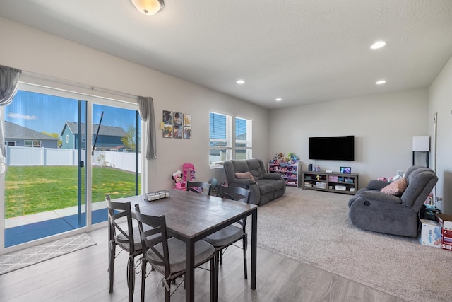 dining area featuring recessed lighting and wood finished floors