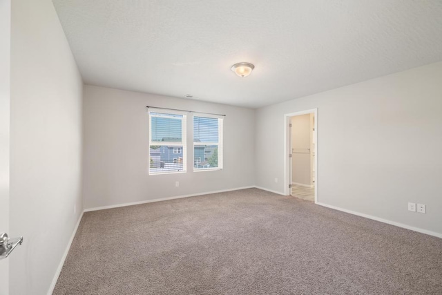 1102 S Best Rd, Spokane Valley, WA 99037 - empty room featuring carpet floors and baseboards