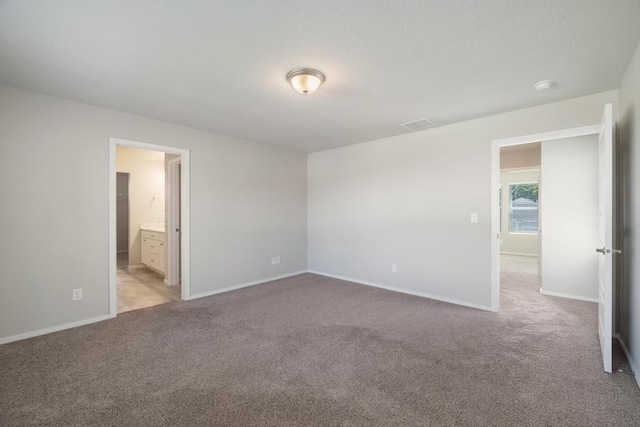 1102 S Best Rd, Spokane Valley, WA 99037 - unfurnished bedroom with light colored carpet and ensuite bath