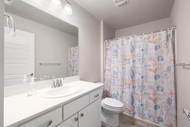 1102 S Best Rd, Spokane Valley, WA 99037 - bathroom featuring wood finished floors, vanity, and a shower with curtain