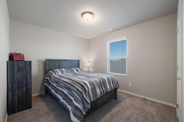 bedroom featuring visible vents, carpet, and baseboards