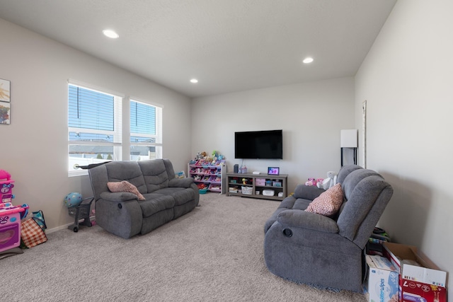 living area featuring recessed lighting, carpet floors, and baseboards