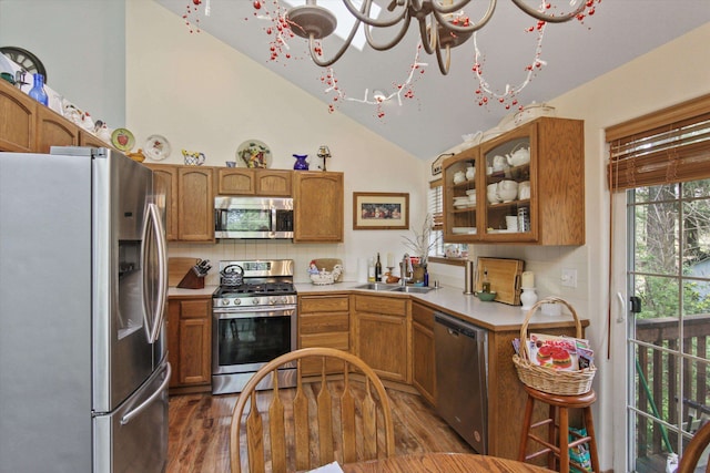 9306 E Lake Rd, Elk, WA 99009 - kitchen featuring appliances with stainless steel finishes, a sink, light countertops, wood finished floors, and glass insert cabinets