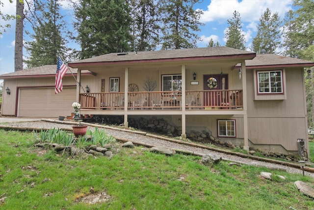 9306 E Lake Rd, Elk, WA 99009 - back of property featuring a shingled roof, an attached garage, a porch, and driveway